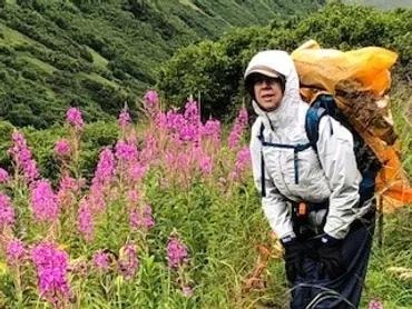 Mim hiking with wildflowers