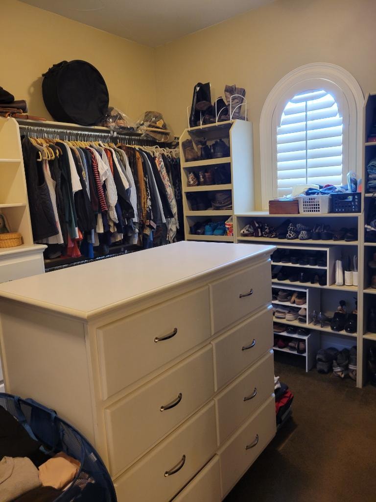 Closet after organizing — neatly arranged walk-in closet