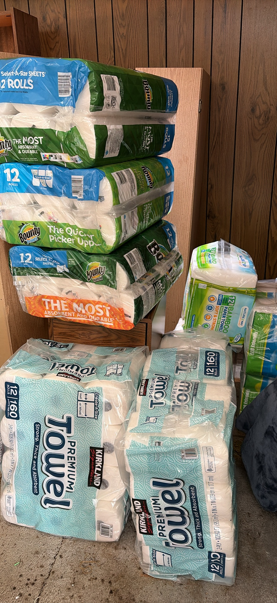 Massive stockpile of paper towels and toilet paper — a classic hoarding situation ready to be organized